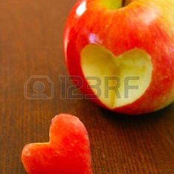 5420449 apple with a loveheart cut out of it