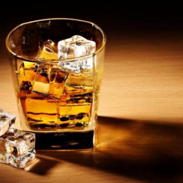 Whiskey drink alcohol ice cubes glass table shadow