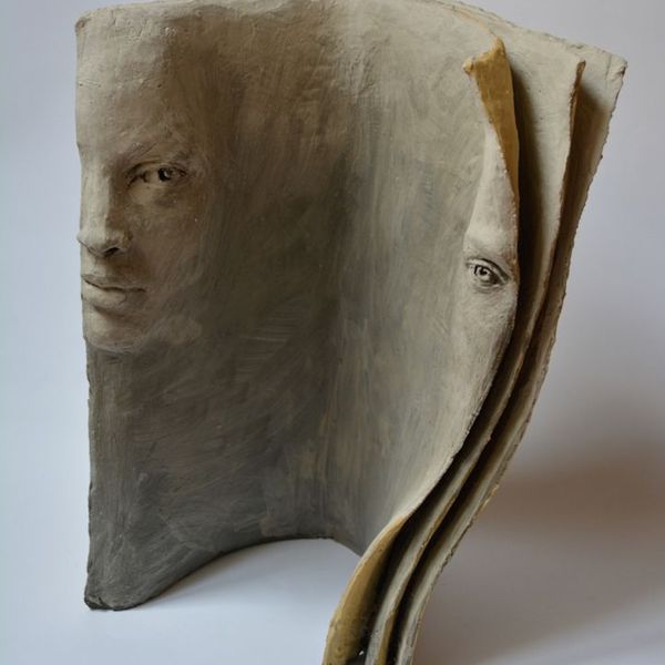 Paola grizi  terracotta book sculptures tell deep stories with faces   my modern met