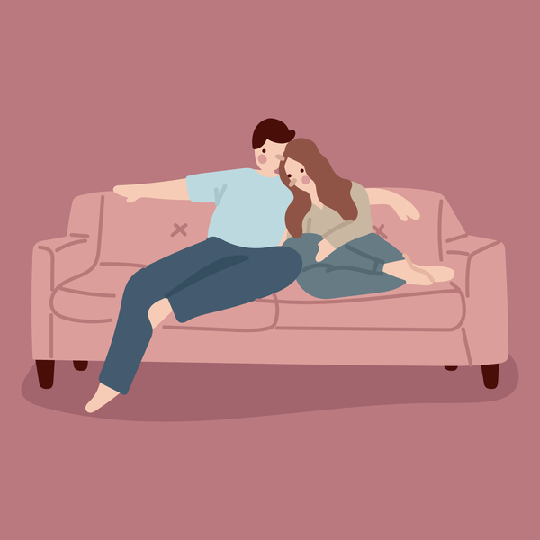 A couple cuddling in the couch