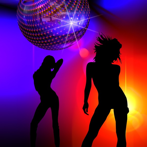 Two silhouettes of dancing girls on a rainbow background and a shiny disco ball